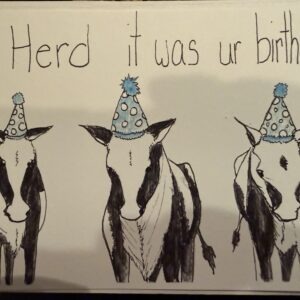 Three illustrated cows wearing colorful party hats, alongside the playful text, "Herd it was ur birthday," celebrating a birthday in a humorous way.