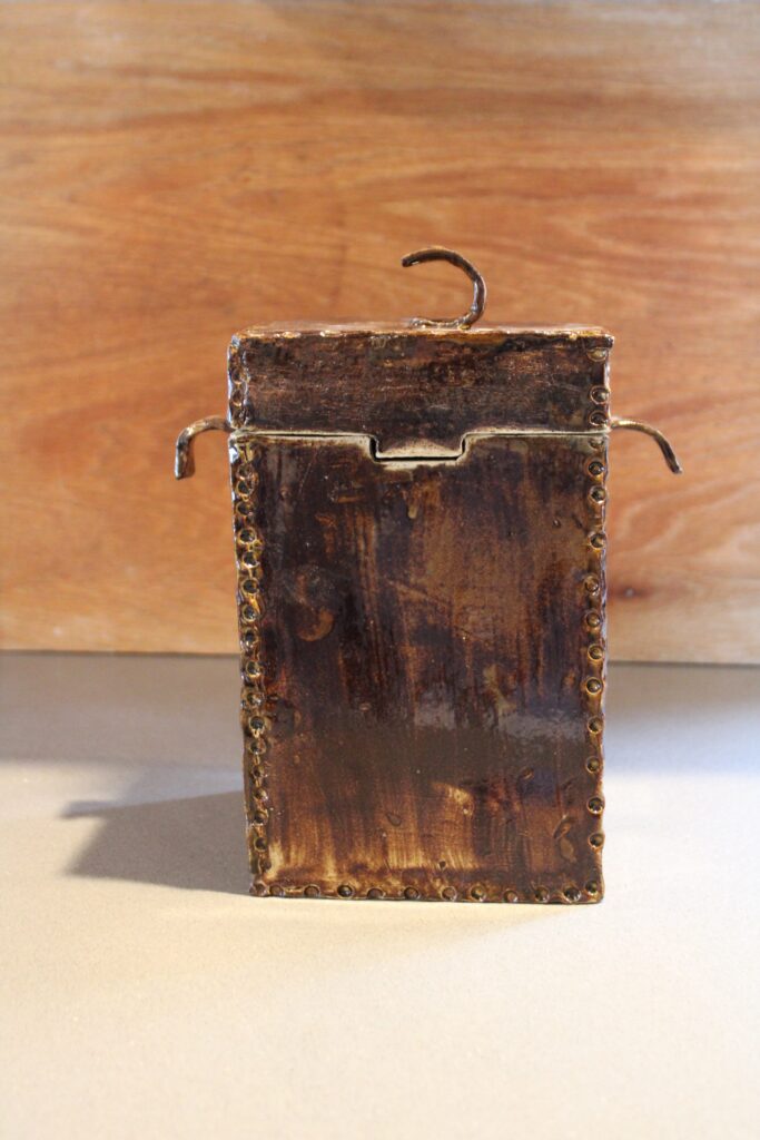 Square handmade ceramic canister with side handles in a rustic brown glaze